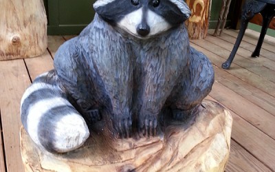 Raccoon wood sculpture